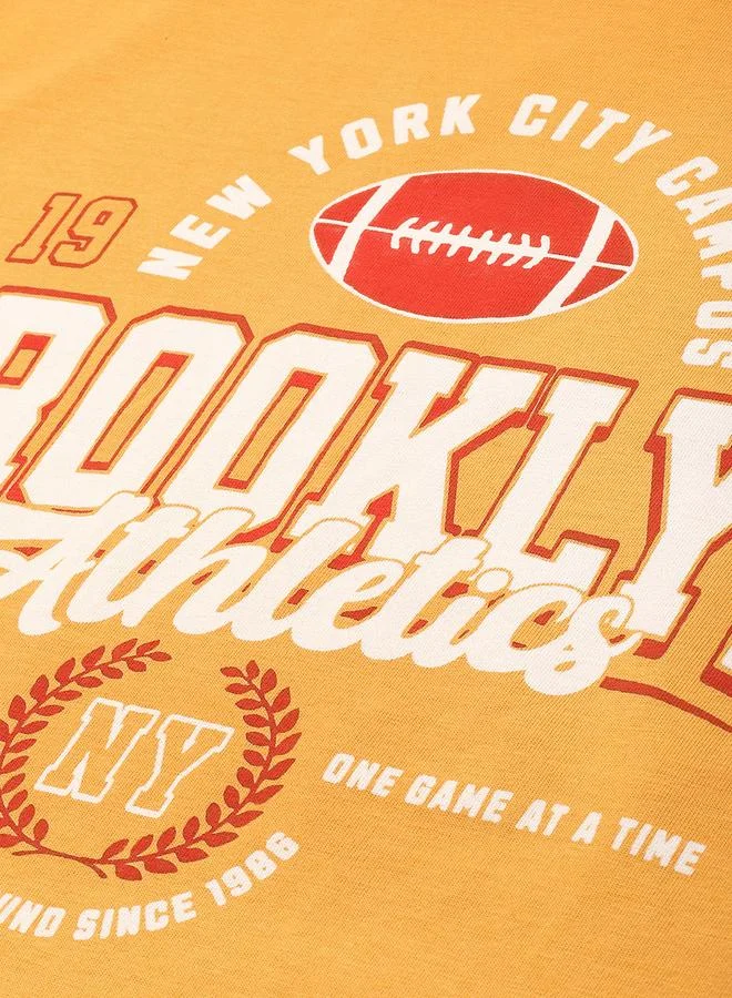 ديلينجر تيشيرت واسع بياقة دائرية وأكمام قصيرة